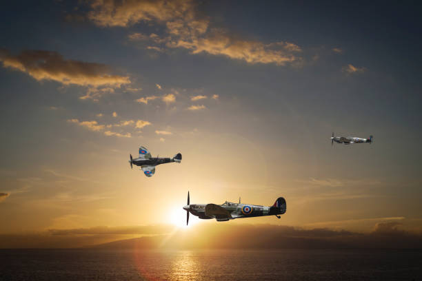 Spitfires at sunset over the sea stock photo