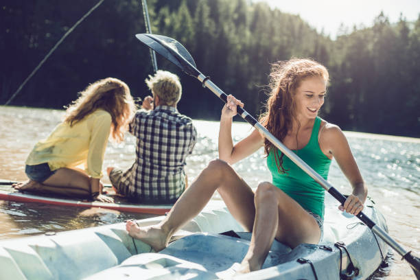 istock Group of Friends Paddle Boarding (sup), Kayaking on Lake 837433416
