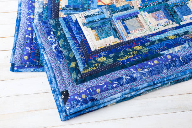 istock decoration, comfort, passion, fondness, stitching, patchwork concept - two dark blue quilt neatly maded of different patches with interesting floral pattern and almost invisible stitches 837439538