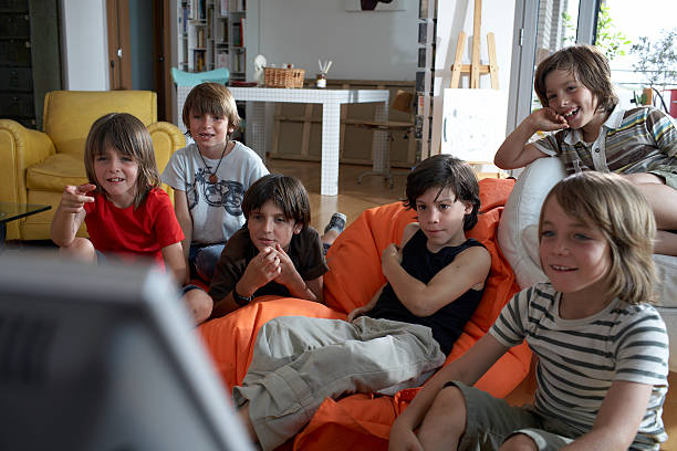 group of boys watch television  9 stock pictures, royalty-free photos & images