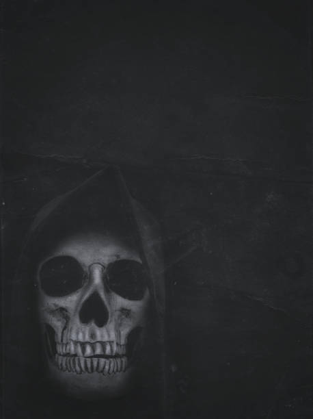 istock Human skull in hood on dark background. Halloween banner 837489764