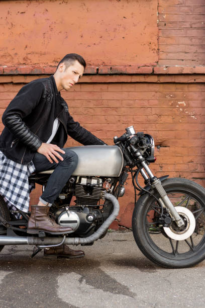 istock Brutal man sit on cafe racer custom motorbike. 837489924