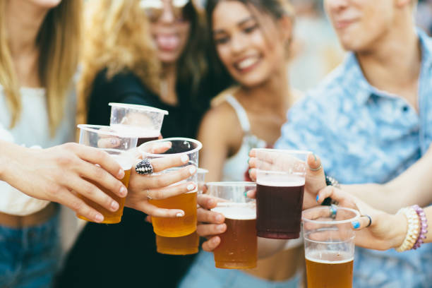 Friends at music festival Friends drinking beer and having fun at music festival beer festival photos stock pictures, royalty-free photos & images