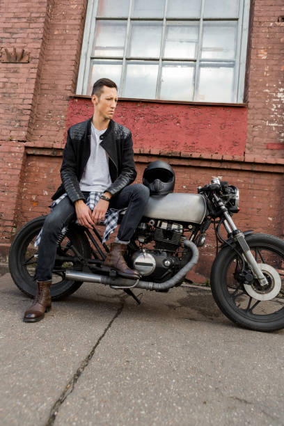 istock Brutal man sit on cafe racer custom motorbike. 837498694