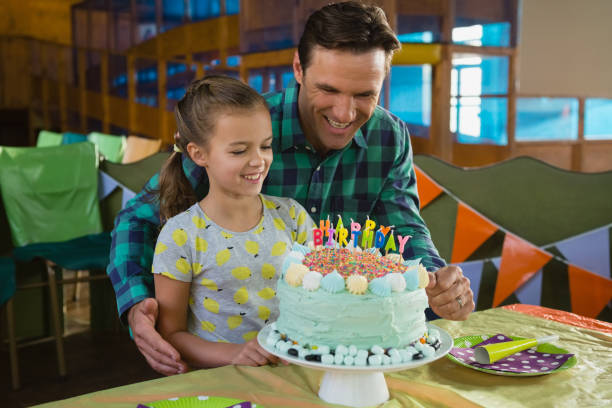 istock Father and daughter with birthday cake 837505122