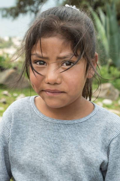 Latin expressive little girl Profound glance of a very young harvesting girl beautiful mexican girls stock pictures, royalty-free photos & images