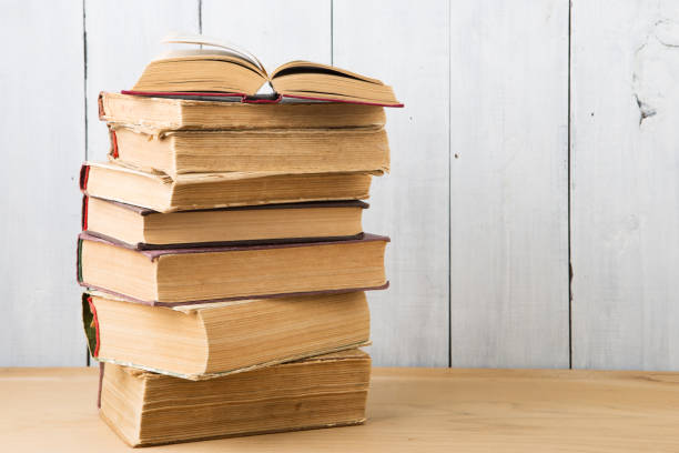 istock stack of books on the desk over wooden background 837520528