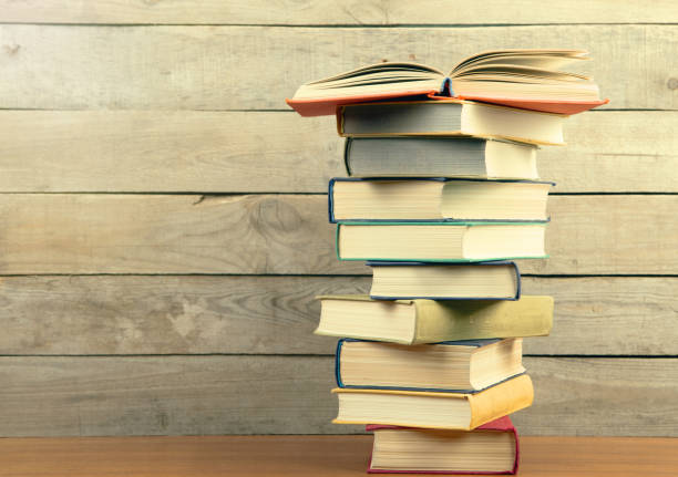 istock books on the wooden background 837520684