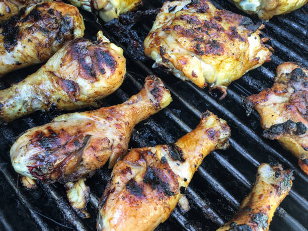 istock Charbroiled barbecue chicken cooking on gas grill 837525254