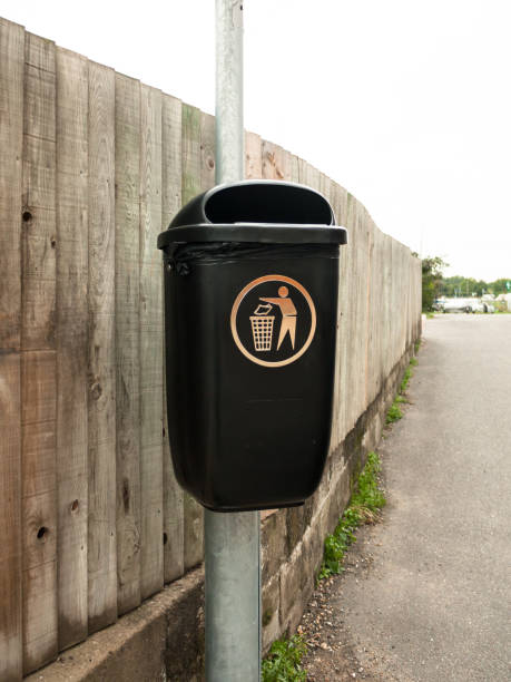 istock a public black bin on metal post isolated 837533000