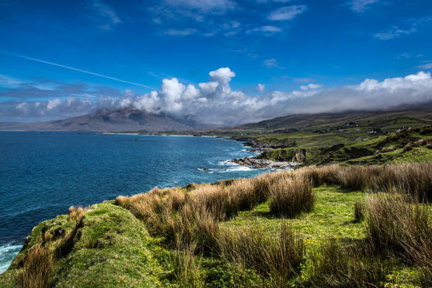 Beautiful Irish coastline on a sunny day with blue skies near Galway The british landscape photo was taken in the UK. connemara national park stock pictures, royalty-free photos & images