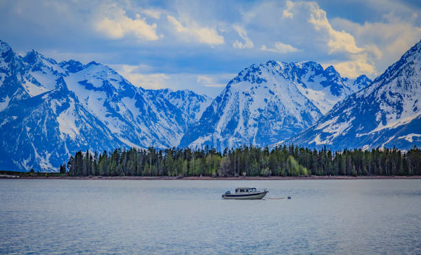 istock Grand Tetons in spring are still covered in snow as boaters explore Jackson Lake on a crystal clear day 837549306
