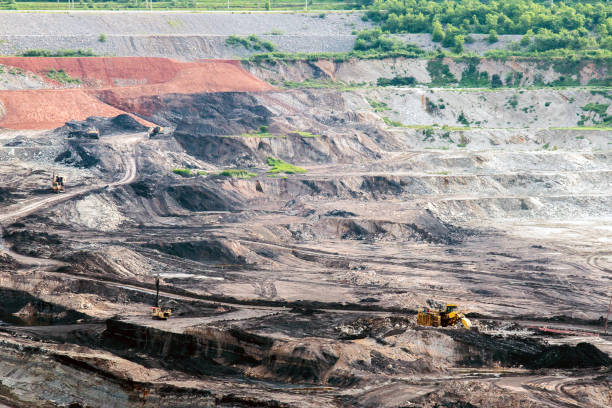 istock Part of a pit with big mining truck working 837549512