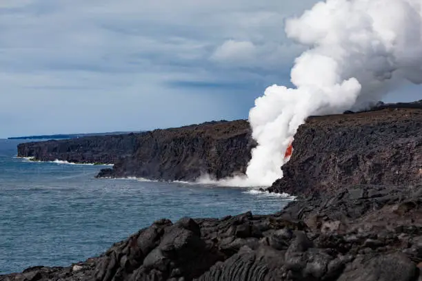 kilauea volcano lava entering the ocean at big island, hawaii islands.