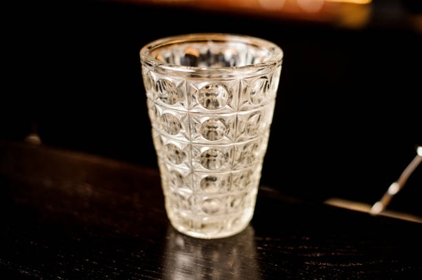 istock empty cocktail glass on a wooden table in a bar 837551086