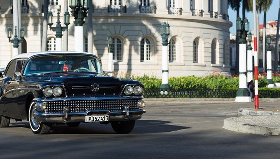 Havana: American black Buick classic car drive in Havana Cuba in the front view - Serie Cuba Reportage