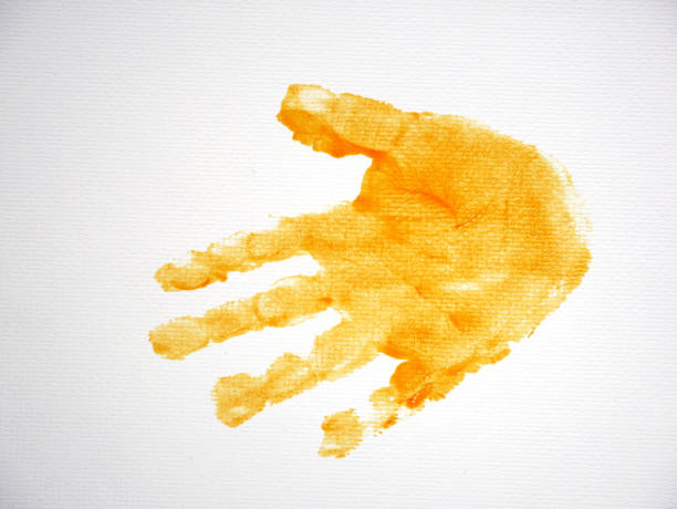 A child's palm print and dirt on the window glass from hands. Traces of baby's greasy hands on the mirror