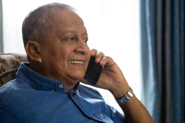 istock Smiling senior man talking on mobile phone in nursing home 837557024