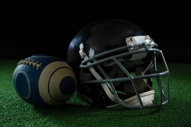istock American football leaning on headgear 837578104
