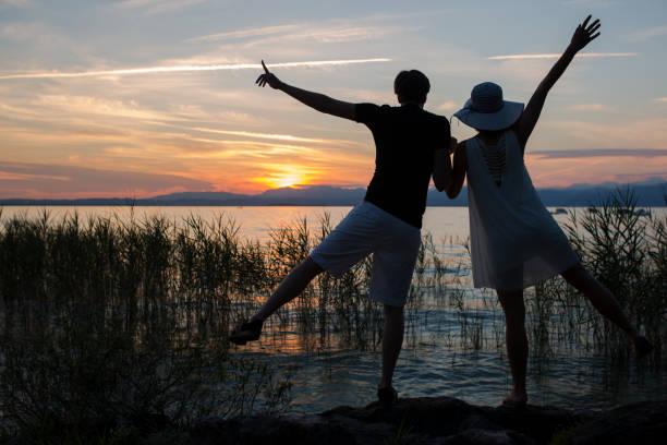 istock Couple on a lake on sunset 837592720