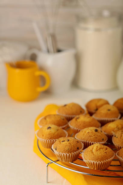istock Kitchen utensils, tools and products for the capcake (muffins) on a light wooden background. 837595260
