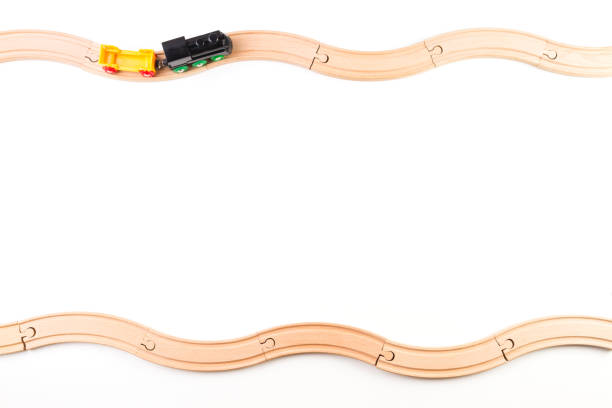 istock Toy train and curve wooden railways on white background. 837600074