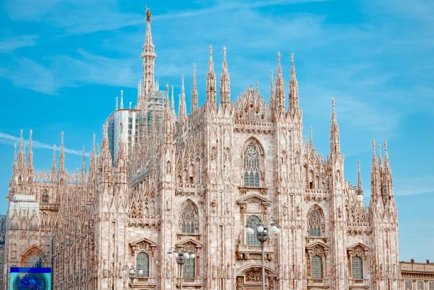 Details of the Milan Cathedral, the spiers and the Madonna Milan Cathedral is the cathedral church of Milan, Italy, dedicated to St Mary of the Nativity sentinel spire stock pictures, royalty-free photos & images