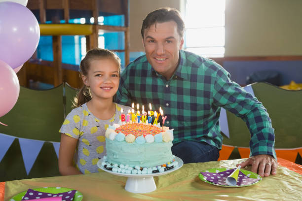 istock Father and daughter celebrating birthday at home 837604874