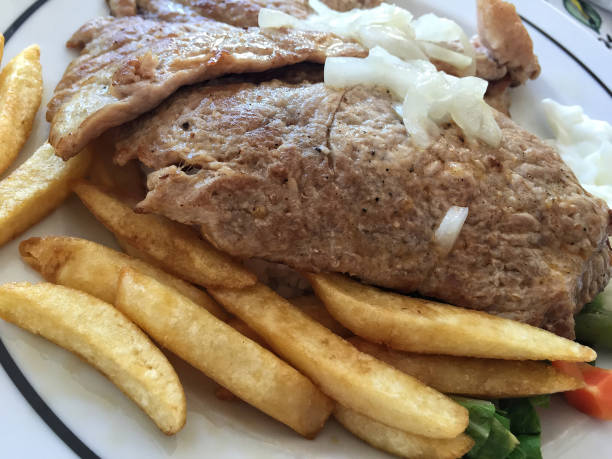 istock steak served with potato fries on plate 837614738