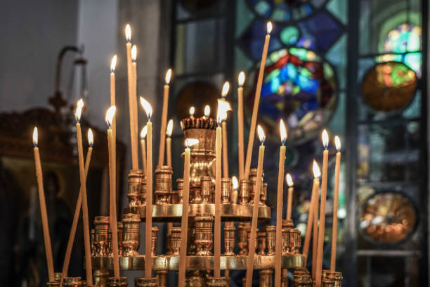 istock candle sticks in a church 837627950