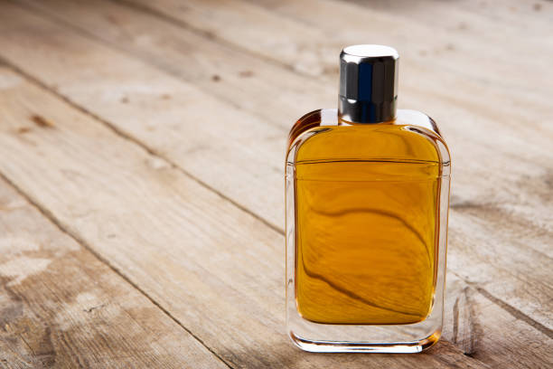 istock perfume bottle on the wooden background 837628276