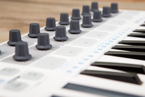 istock Close up of MIDI controller volume fader, knob and keys. 837631718