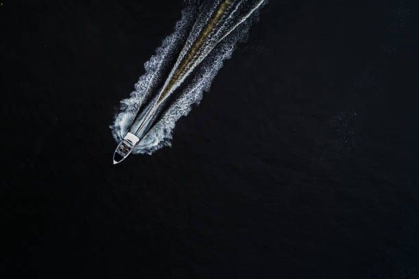 Two yachts are rafted along the Dnieper River. Sailing sport. Competitions on the water Two yachts are rafted along the Dnieper River. Sailing sport. Competitions on the water. Top view. Aerial view landscape arch photos stock pictures, royalty-free photos & images
