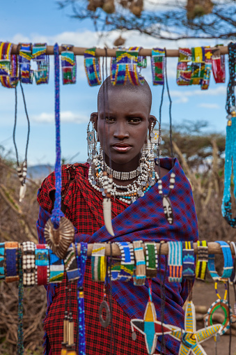 A woman who does her own work from the Maasai tribe.