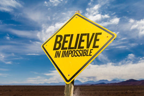 believe in impossible - success failure dreams road sign imagens e fotografias de stock