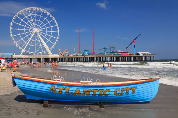 Boat lifeguard, beach and steel Pier in Atlantic City, New Jersey stock photo