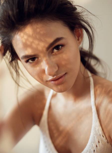 istock young beautiful woman with shadows on the face 837724262