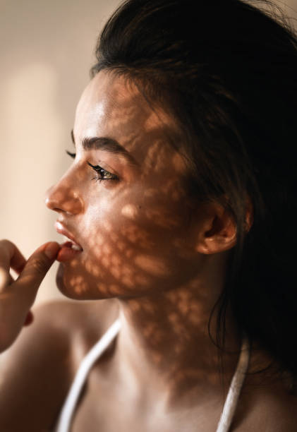 istock young beautiful woman with shadows on the face 837724264