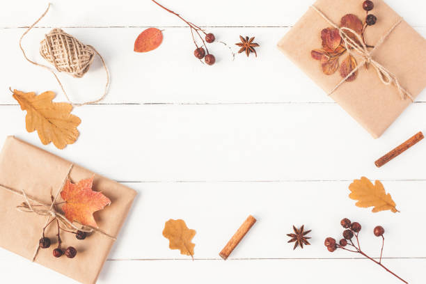 istock Gift, autumn leaves, cinnamon sticks. Flat lay, top view 837736744