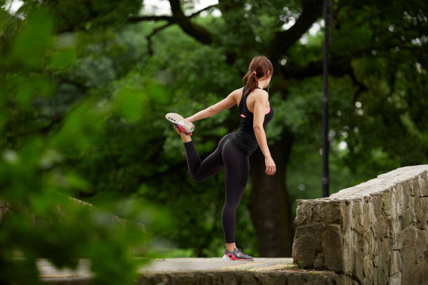 istock Sportswoman stretching in summer park 837769592