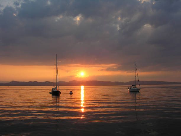 istock Boats at anchor at sunset Lake champlain 837774014