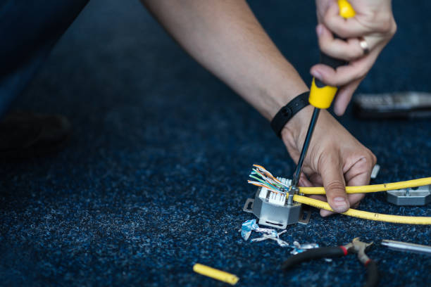 istock Specialist connect a network cable with RJ45 sockets, process of laying the local network. Set 837781676