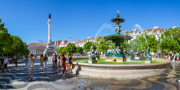 Rossio Squareo on Beautiful Sunny Summer Day in August 2017 with People Bustling in Lisbon Portugal