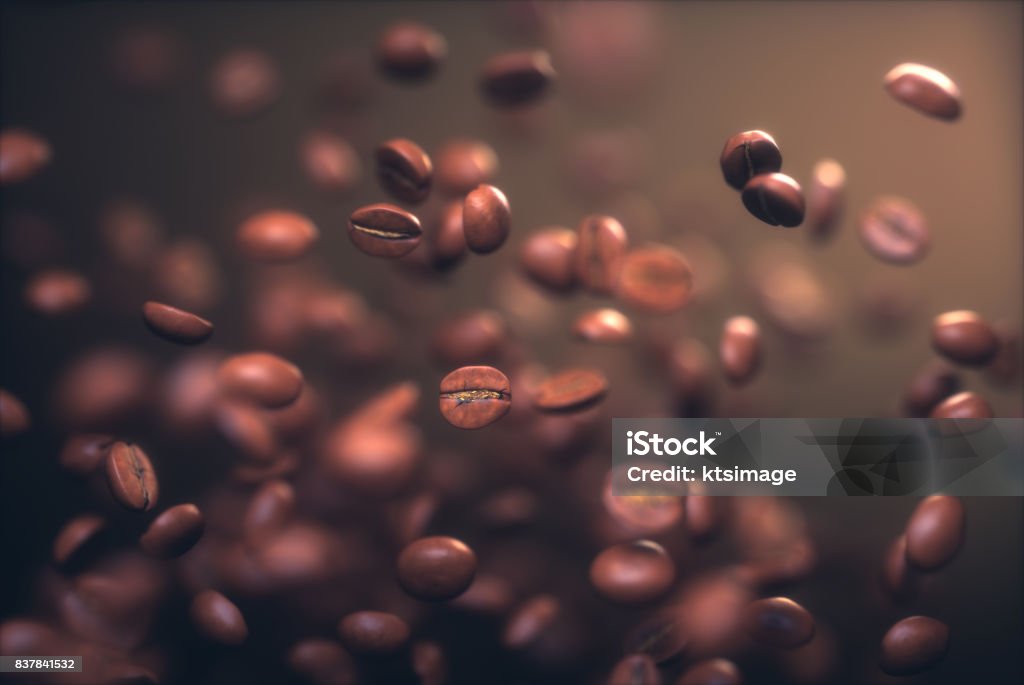 Roasted Coffee Beans Roasted coffee beans, frozen grain in the air with shallow depth of field. Roasted Coffee Bean Stock Photo