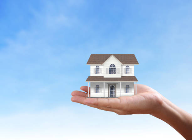 istock Mortgage concept by house from  hand 837848766