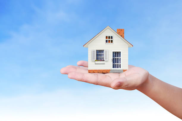 istock Mortgage concept by house from  hand 837848806