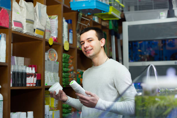 istock young man with pet supplements in petshop 837855968