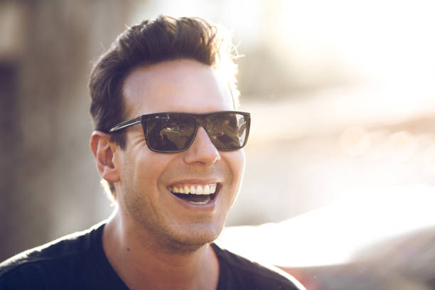 istock Man smiling and wearing sunglasses 837856670
