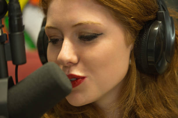 istock Pretty redhead student hosting a radio show 837871488