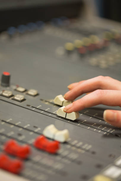 istock Student working on sound desk adjusting levels 837871644